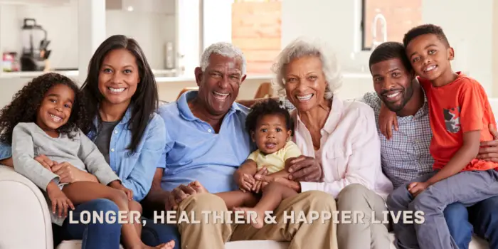 Happy multigenerational family sitting together, symbolizing Agrim Ayu Care’s mission and vision of creating longer, healthier, and happier lives through Ayurved.